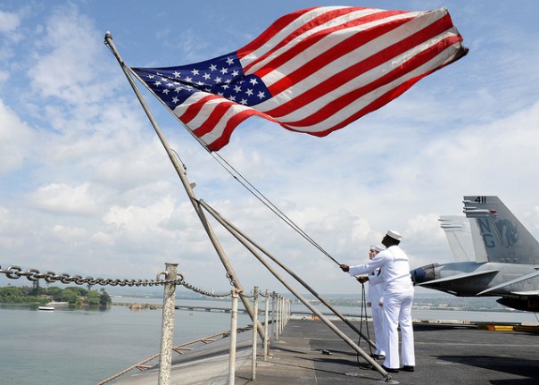 "Sailors raise the American Flag by The Official U.S. Navy Page licensed by CC BY 2.0